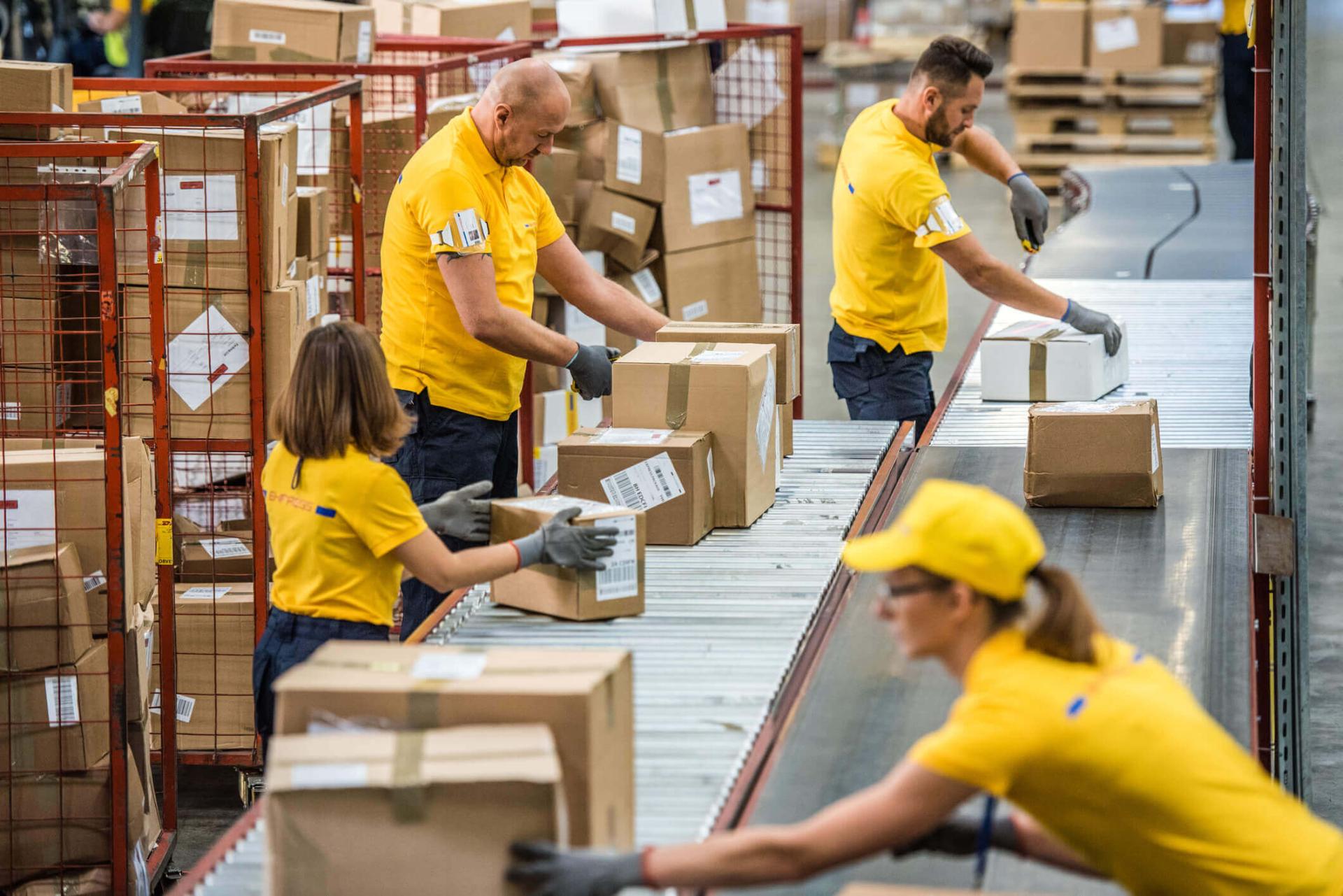Warehouse operators processing orders on a picking line to achieve the Perfect Order Metric